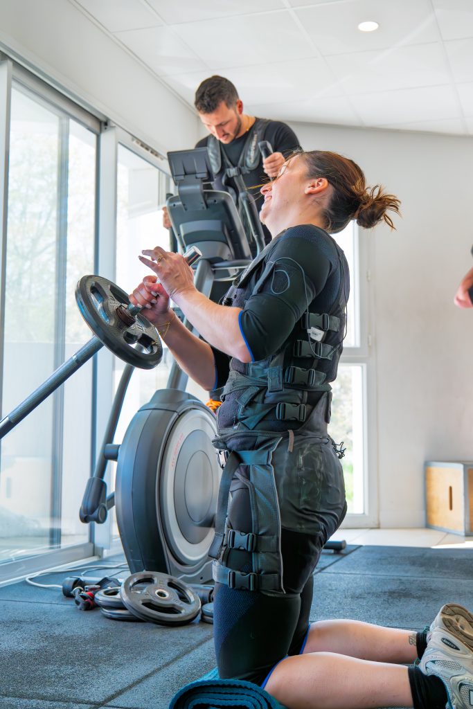 Exercice avec disque guidé par le coach Fit'Elec